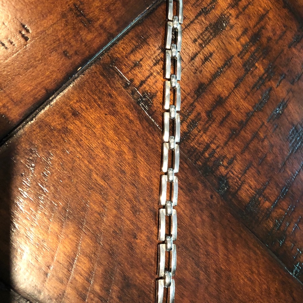 Silver link bracelet.
